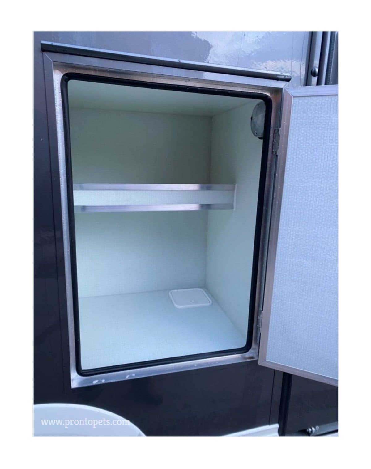 A large crate with the door open